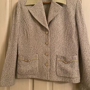 Green with black and white woven into fabric it’s a 12 with gold and black trim